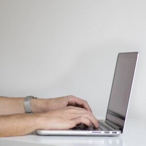 Man's hands on a laptop